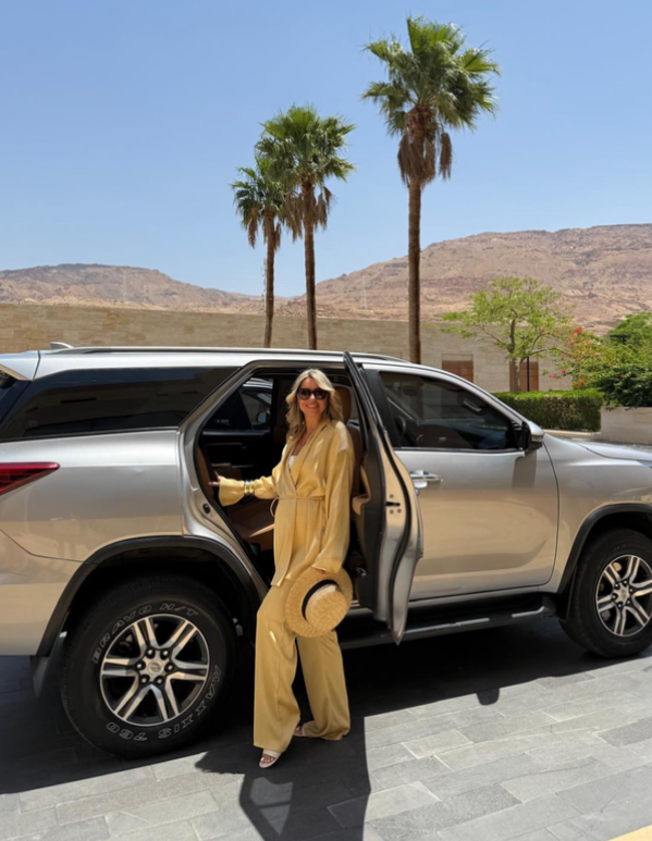 Traveler getting into an AutoSepo vehicle